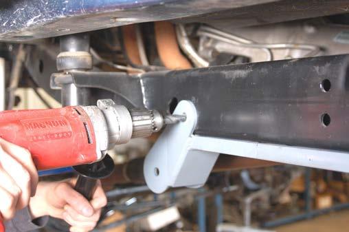 Clamp in place using a large c-clamp. See Photo 13.