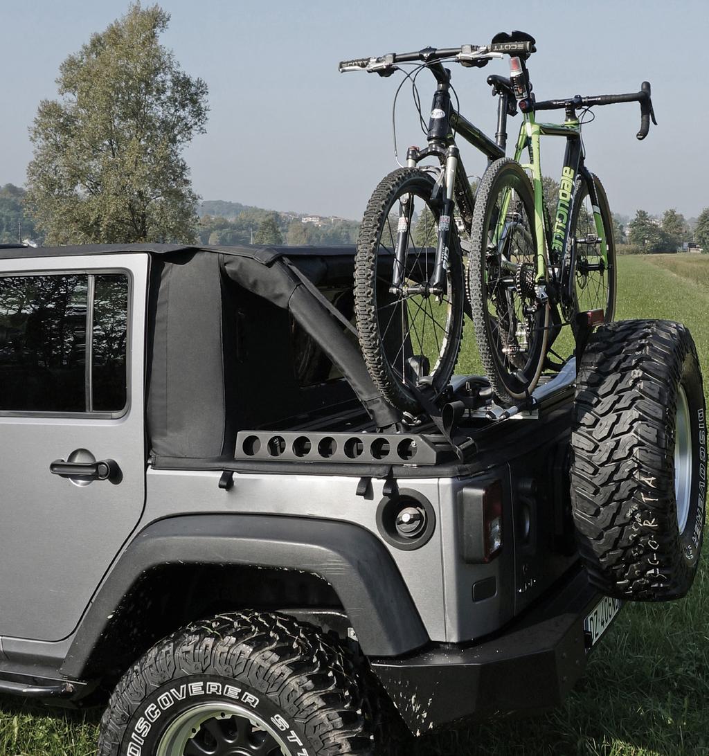 These are two heavy-duty bars that fix onto the Cargo Rack allowing you to safely carry two bikes on your JK.