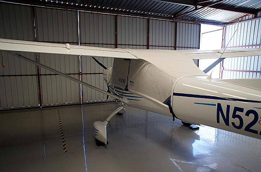 The cover is pulled back over the vertical stabilizer and a plastic all-weather zipper is