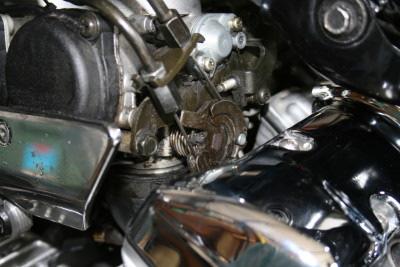 13. With the carb assembly loose it slides straight out the left side until you can get to the throttle cables. 14.