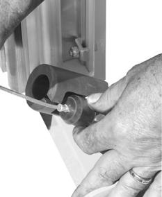 To reset the Safety Latch, replace the rubber stopper into the housing using the side access slot. 7.