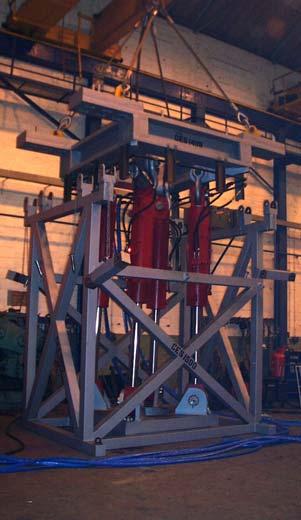 The system includes a work-deck allowing ease of riser connection make-up. Tension deck allowed full drift capability for large diameter riser connections & wellheads to pass through.