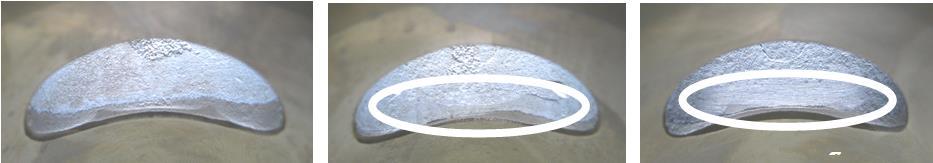 The top edge of the exhaust port may show either just a cast finish surface (left picture) or signs of a