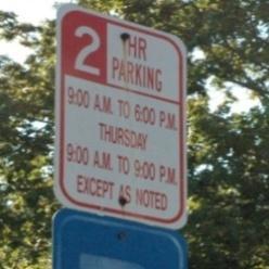 existing parking signage and calls out specific instances where signage is unclear.