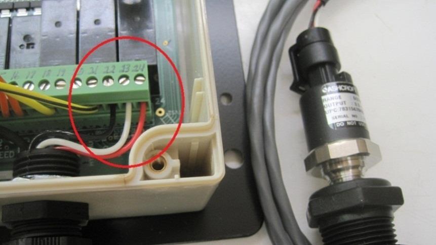 Run the transducer through the cable gland that contains the antennas for the unit. 4. Screw into the following terminals on the 24 position green terminal block. a. Red into terminal 24 (5VDC) b.