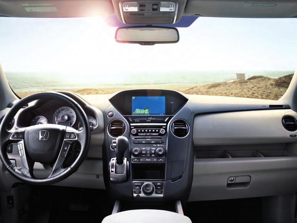 Pilot 4WD Touring shown with Gray Leather. The intelligent Multi-Information Display (i-mid) is your hi-res command center right up front.