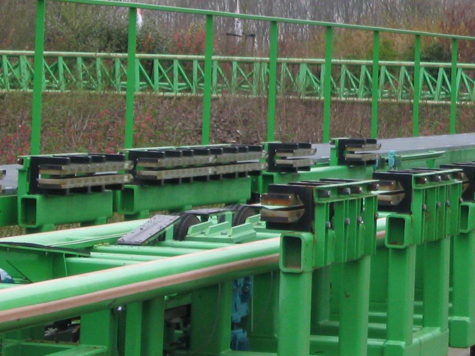 OpenStax-CNX module: m42404 8 Figure 7: The rows of rare earth magnets (protruding horizontally) are used for magnetic braking in roller coasters.