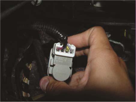 The brake pedal switch has a 4 wire connector violet/red, black/blue, yellow/green, and violet / white.