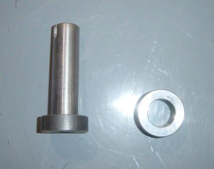 Use the factory leaf spring bolt and tab nut to fasten into place.