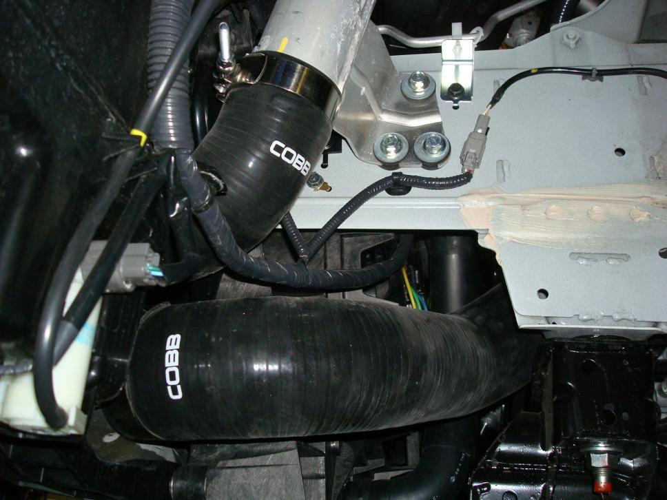 This is the clamp that secures the intercooler pipe to the left side turbo outlet as viewed from above the