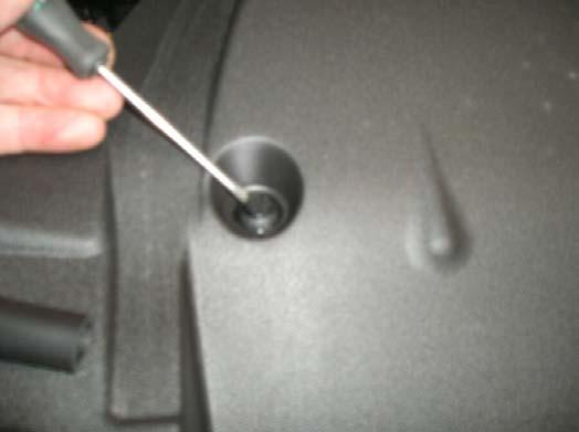 small flat blade screwdriver to assist removal. 6. Remove lower bumper retaining screws. 7.