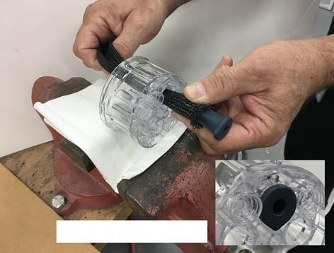 3. Cut the flange off with scissors, then pull the rest of the pinch valve out of the top of the pinch valve body. UP molded on valve body Points on valves point to center of chamber.