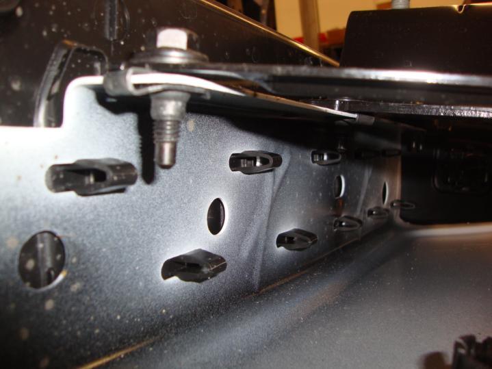 Begin by removing the plastic top pad and center component from the bumper end caps by pulling up from the outside edge.