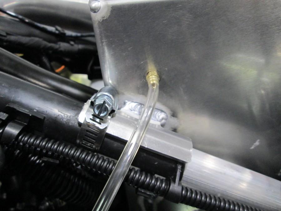 Install the hose clamp on the cold air bracket.
