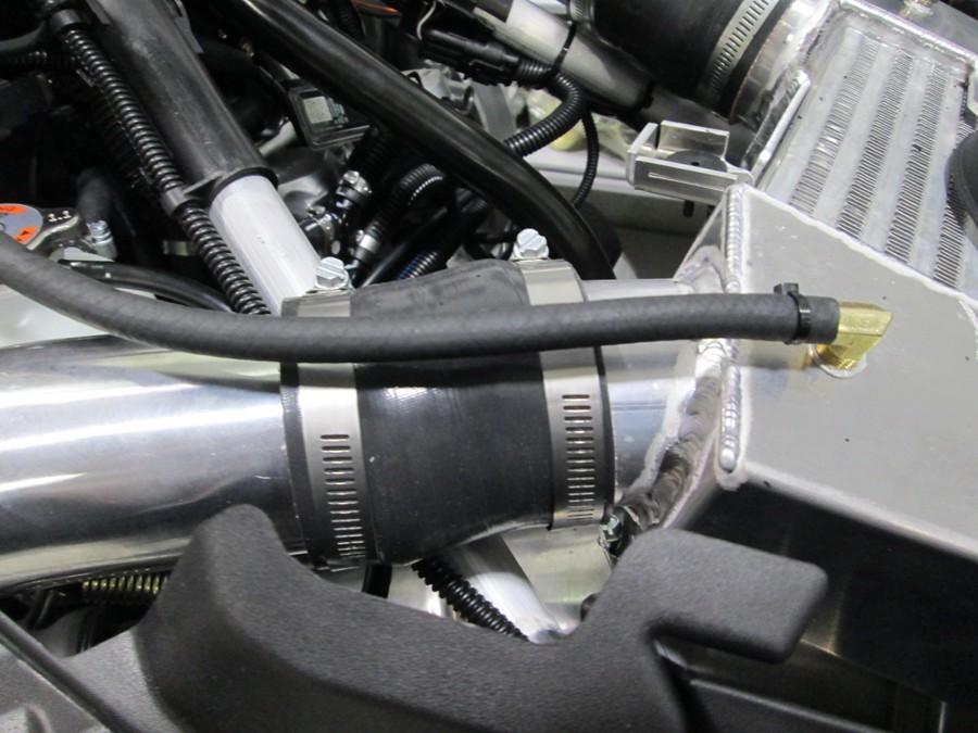 Install the silicone hose on the cold air intake box tube.