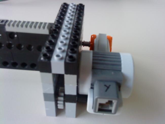 It is part of the movable x-axis and with a bridge connected to carriage 2.