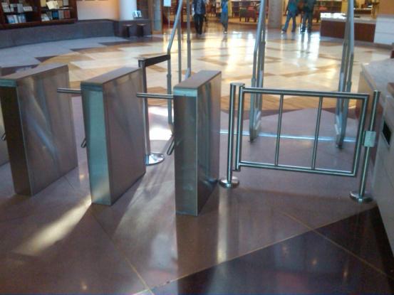 System users present access credentials to a reader installed in the turnstile. If the credential is valid, the barriers open and the turnstile allows a single user to pass through the lane.