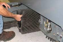 REPLACING OR ROTATING THE MAIN BRUSHES The front brush can be accessed on the left side of the machine and rear