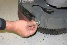 Pull the squeegee out from the side brush assembly. 1. If necessary, raise the scrub head.