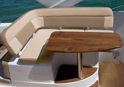 Teak table), double aft-facing lounge seats, and aft port/starboard L-lounges (also with storage under).