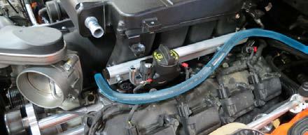 Remove the oil fill cap from the stock intake manifold and install it on the supercharger.