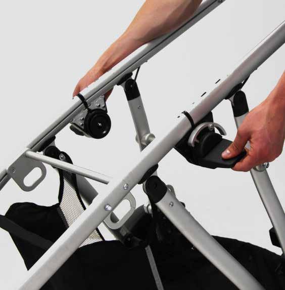 Push down the release levers () to completely lock the frame.
