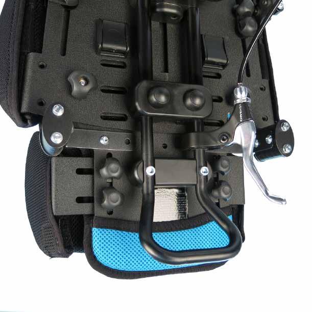 Jacket/Sternum Harness Fitting the Jacket/Sternum harness Feed each of the shoulder straps through the appropriate slots in the backrest padding and the metal backrest ().