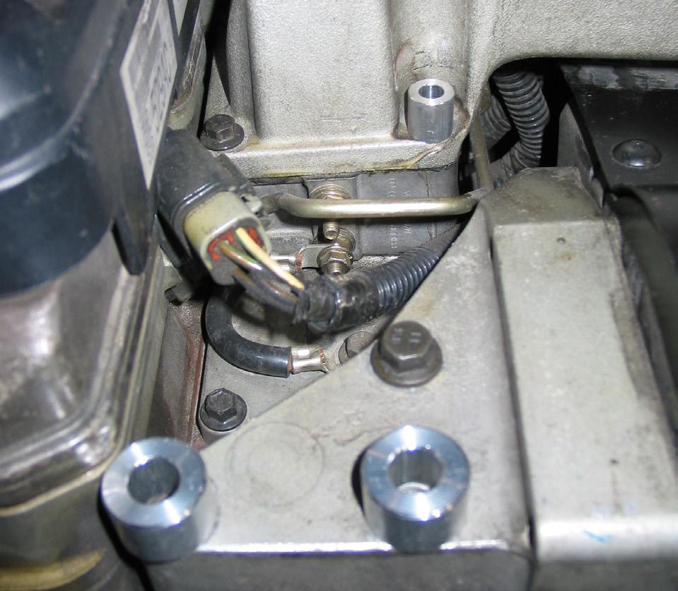Obtain the best clearance of the compressor to coolant hose and compressor to intake horn as possible.