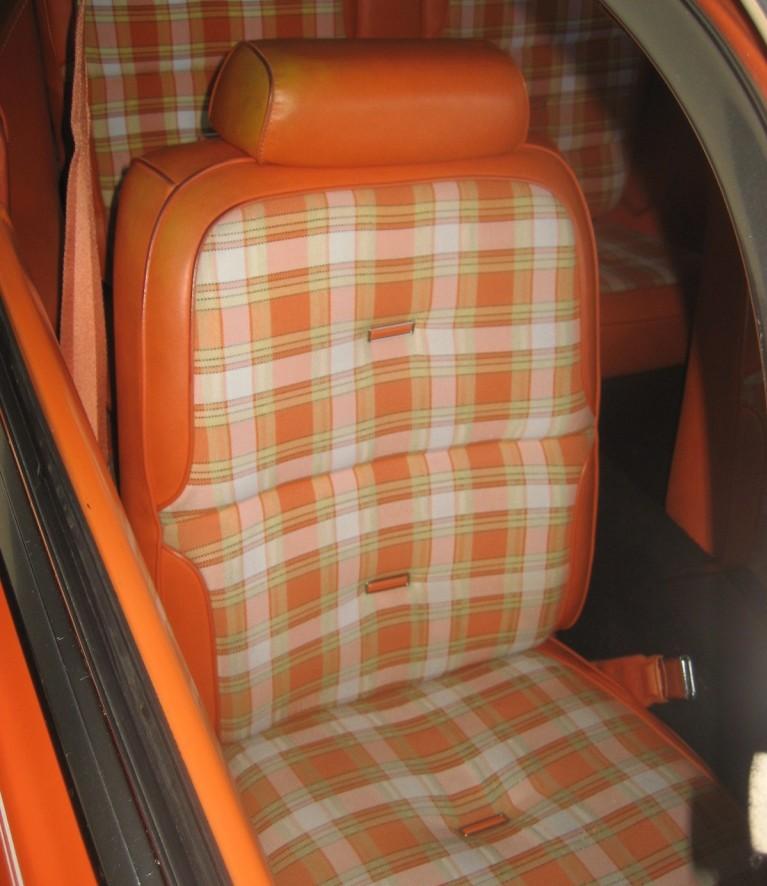 The back seat of a 1958 Series 62, with its embossed V above the armrest.