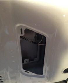 the tailgate and locate the plastic vent on the inside of the door.