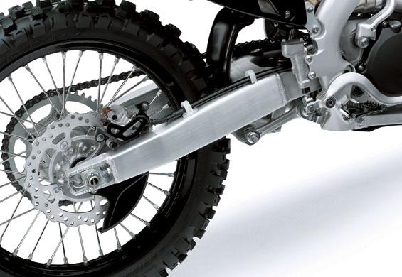 The centre of gravity and key dimensions (swingarm pivot, output sprocket and rear axle locations) were chosen so that the rear tyre would drive the bike forward (instead of causing it to squat).