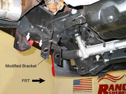 5) With the help of an assistant, carefully raise the front differential assembly up into the left and right drop brackets.