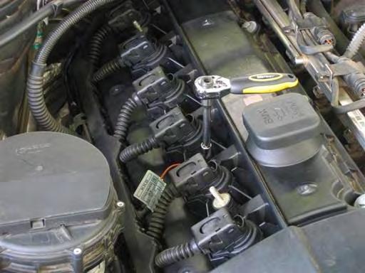 Install ignition coil electrical harness. Install coil harness rail on valve cover and clip into place.