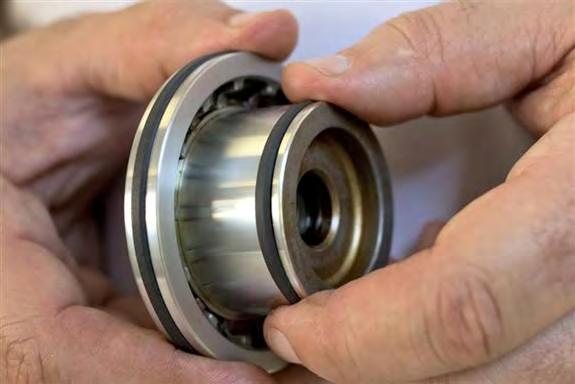 Once stretched and installed, Teflon seals will fit loosely in piston grooves. Repeat seals installation for second piston.