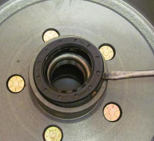 Do not drive the seal out by hitting the bearing since this may damage the bearing.