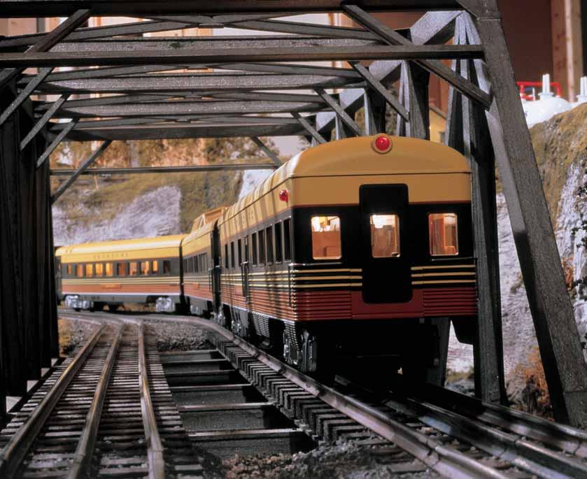 2. The accommodations on the Seaboard train look warm and cozy as the passenger consist passes through a truss bridge and heads for the mountains.