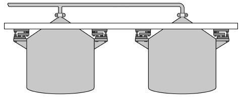 When a single discharge pipe is used by adjacent tanks (see Figure 5-23a), the weight of material being