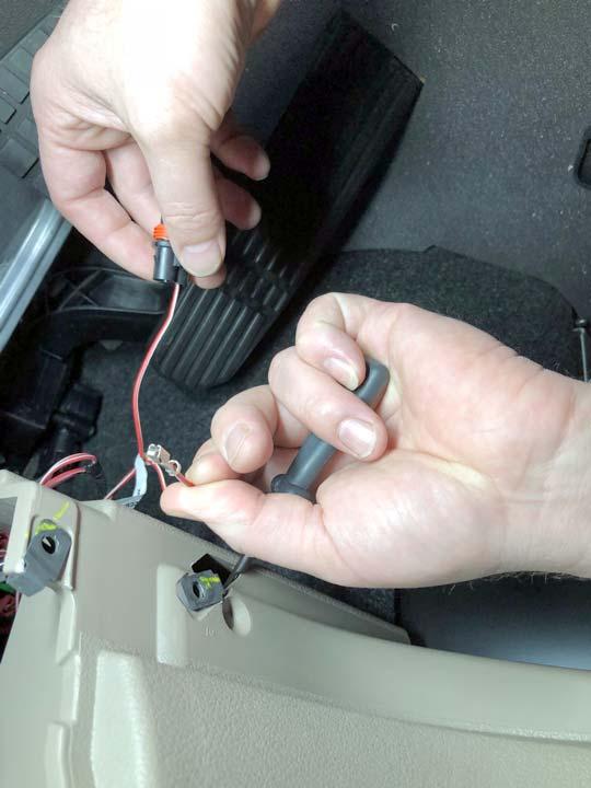 remove one of the pins from the connector. See Fig. 7. A.
