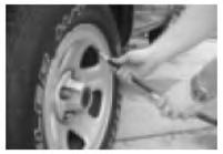 a) Remove tire valve cap.