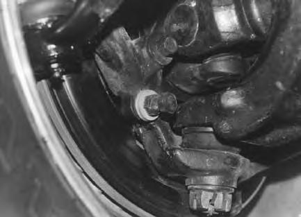20. Install new coil springs. Raise jack up so that enough load is applied to hold coil springs in place. 21. Remove and replace the lower links with new Skyjacker Flex Series links.