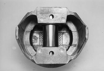 Underside of an typical cast aluminum piston which does not have a steel strut.
