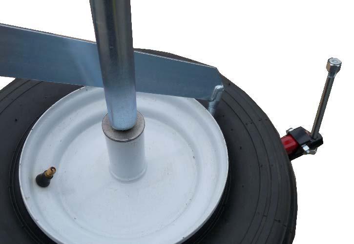 Demount deflated tire using the "rod end" of the Mongoose Tire Tool (see Fig. 7). The ball end is pushed under the top bead and rested on the rim as illustrated.