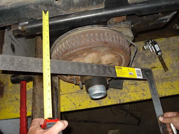 7. Slide the sub frame under the trailer. It is very important to center up the axles side to side as well as forward and back.