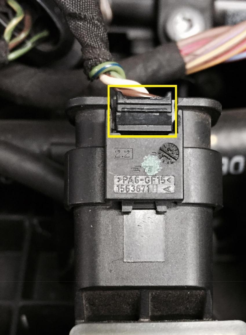 PLUG B: JB1 and JB4 The boost sensor plug on the manifold is removed by pushing the grooved tab down on the end of the sensor (yellow square) and pulling the plug towards the back of the car.