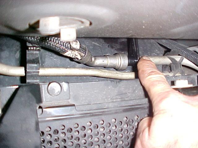 Using oil, insert PLB-1212 into one end of the provided FL-1002 fuel line. Feed line over frame to the stock fuel connection. D.