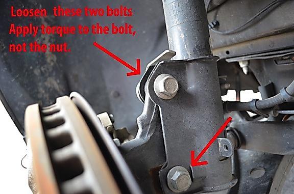 But before we remove the strut, we need to remove the ABS line, brake bracket, and the swaybar end link, which are all attached to the strut. 11.