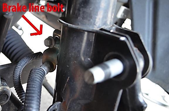 12. Remove the brake line bracket from