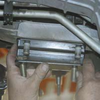 26. Install the new Skyjacker passenger side differential bracket with the offset holes toward the front bumper of the vehicle & the open portion of the bracket toward