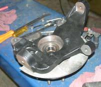33. Attach the hub bearing assembly to the new Skyjacker steering knuckle using OEM hardware.