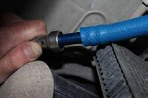 Helpful Hint: If more space is required to access the top of the fuel tank, loosen the strap nuts to the end of the stud.